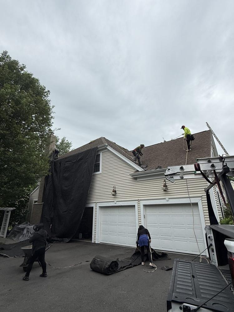 Roof tear-off and replacement in progress