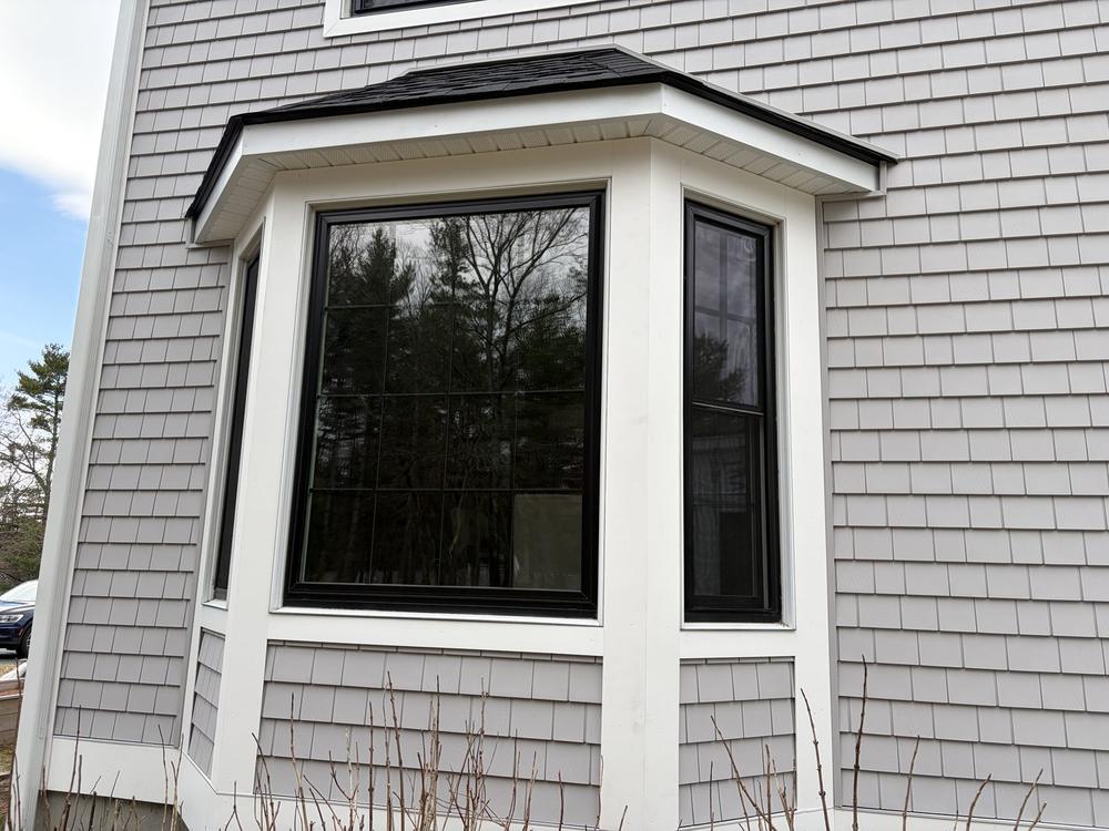 Custom cedar shake siding around a bay window